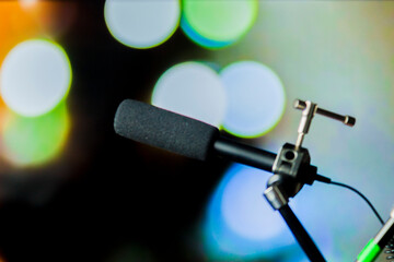 Podcast microphone on colored background with copy space. mic in studio. Microphone concept. Podcast concept.