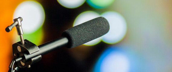 Podcast microphone on colored background with copy space. mic in studio. Microphone concept. Podcast concept.