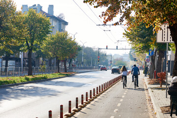 Cyclists on bike path in city