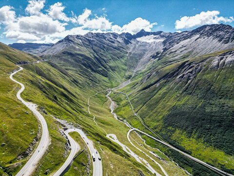 Fototapeta Drone shot of Swiss Mountain Roads, The Furka Pass and Susten Pass next to the Rhone Glacier