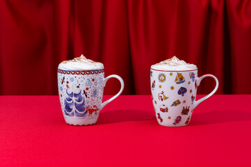 Christmas cup of cappuccino on red background