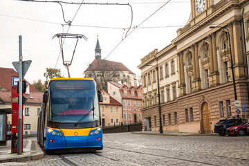 Modern Tram in old stree of Prague in a summer day, Czech Republic. The Prague tram network is the third largest in the world. Passenger Eco-friendly electric transport connection in the Europe City