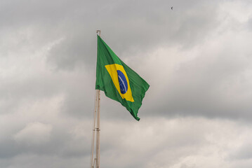 Brazilian flag flying on an iron bar