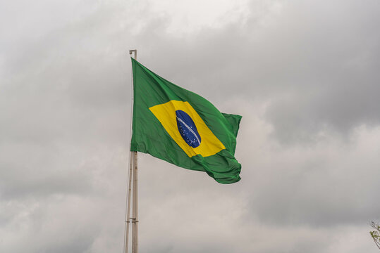 Brazilian flag flying on an iron bar - Powered by Adobe