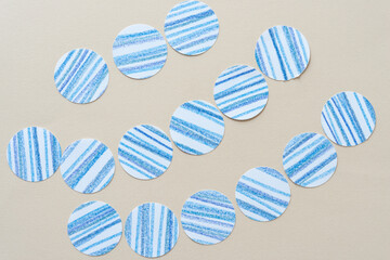 paper circles with freehand blue lines on beige