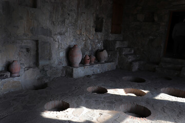 Georgia, Kakheti - November 2021:  Nekresi Monastery near the Alazani Valley. Wine cellar with old qvevris. Ancient walls of the monastery