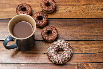 Various chocolate donuts and chocolate milk cup