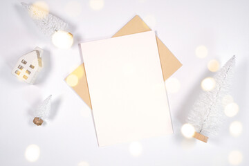 Christmas 5x7 greeting card, party invitation mockup, styled with white reindeer and mini trees,...