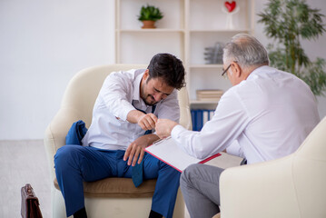 Young businessman employee visiting psychologist
