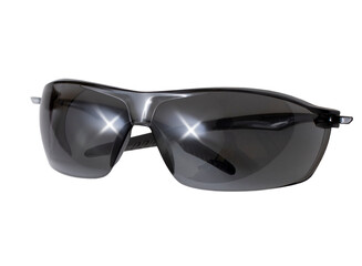 Dark sports closed sunglasses with glare from the sun on the surface isolated on a white background, close-up