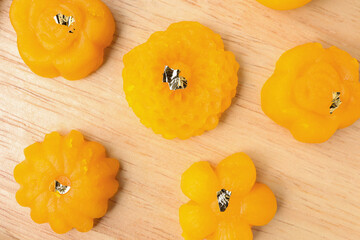 Traditional Thai dessert. Thong-ek made from yolk, wheat flour and edible gold.Thai dessert on wooden background.