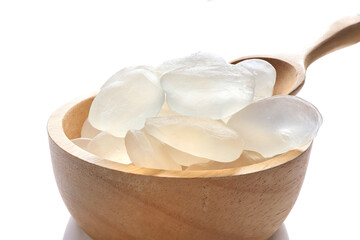 Candy palm seed, Close up of palm seed, palm fruit seeds or Arenga pinnata in wooden bowl isolated on white background.