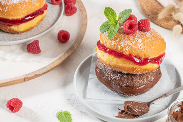 Bolas de Berlim, or Berlin Balls. Portuguese fried dough with sugar, Filled with chocolate or raspberry jam. Portuguese fried dough with sugar.