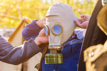 Man in gas mask with selective focus. Background