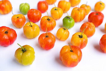 Fresh Barbados cherry, Malpighia emarginata, red acerola cherry on white background. Selective focus. background of beautiful home red acerola cherry.