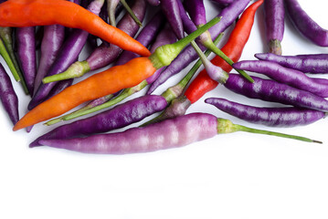 Close up of Fresh purple chilli, Purple 'Buena Mulata' hot chili pepper on white background.Top view