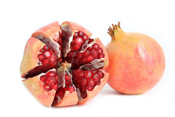 Red ripe pomegranate fruits and open pomegranate on white background. 