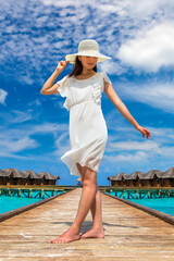 Woman standing on the wooden pier