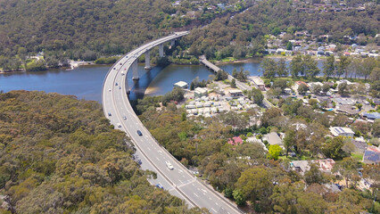 Aerial drone view of Woronora River Bridge across Woronora River in the Sutherland Shire, Southern...
