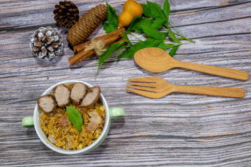 My breakfast, bacon fried rice, garlic and pepper roasted pork sprinkle with dried rosemary scent at the end paste with basil on top and copy space.