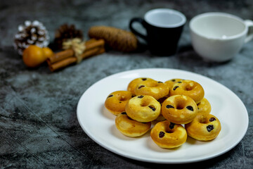 Donuts stuffed raisins it have fragrant hot from the stove served put in a plate and eat with coffee in the morning it's so good.