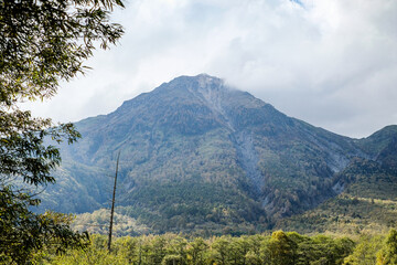 Fototapeta premium Mt.Yake-dake with Taisho Pond (Taishoike) was formed in 1915, when an eruption of the nearby volcano Mt. Yakedake dammed the Azusa River.