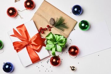 christmas decorations and presents on a white background with copy - space for your text or message to the right side