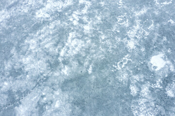 icy lake surface pattern. aerial view of surface of frozen lake. aerial top view.