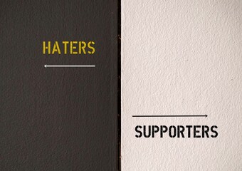 black and white wall with direction points to HATERS and SUPPORTERS, means stop focusing and trying to prove your haters wrong, focus and try to prove your supporters right