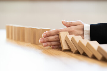 Protection finance, stopping falling block effect collapse domino wooden, Recovery risk business, Management strategy and planning before destroy. Successful intervention.