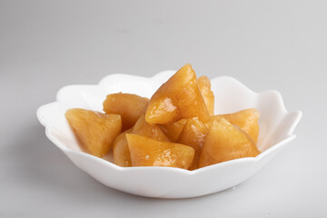 ba zhang steamed in a steamer Chinese national food.In a white cup of syrup