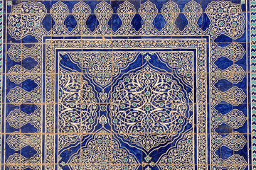 The floral tile walls in Khiva look like the carpets. Uzbekistan.