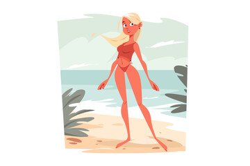Blonde woman in red swimming suit on beach