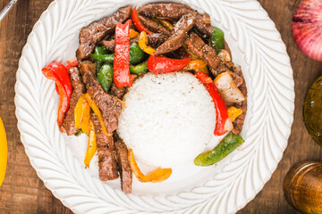 A plate of fried beef rice with green pepper
