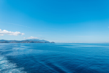 Fototapeta na wymiar Beautiful blue skyline with sea, Elba island and sky in Italy
