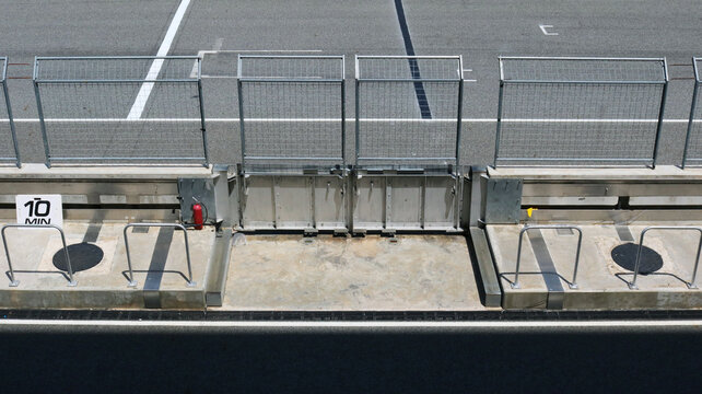 Steel Wire Mesh Fence With Service Footpath In Race Track Aerial Top View.