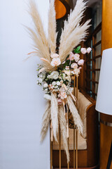 Beautiful flowers, decorations on a stand in a restaurant, interior. Photography, wedding, design.