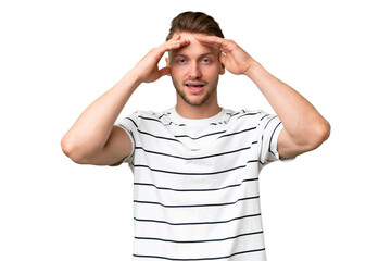 Young blonde caucasian man over isolated background with surprise expression