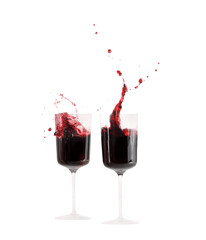Isolated with two red wine glasses with splashing  - obrazy, fototapety, plakaty