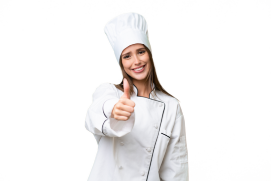 Young chef caucasian woman over isolated background with thumbs up because something good has happened