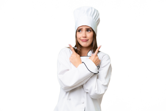 Young chef caucasian woman over isolated background pointing to the laterals having doubts