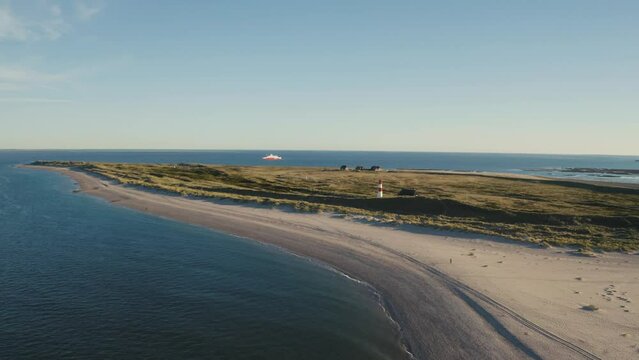 Sylt, Lighthouse Ellenbogen, Northernmost point of Germany. Schleswig-Holstein, North Sea. 4K drone. Beautiful tourist destination and attraction from above.
