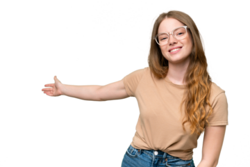 Young pretty woman over isolated background extending hands to the side for inviting to come