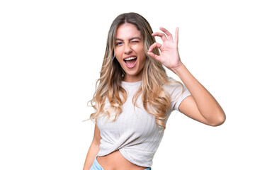 Fototapeta premium Young Uruguayan woman over isolated background showing ok sign with fingers