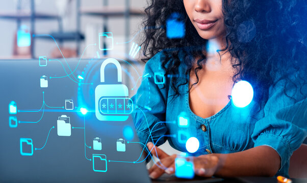 African woman typing on laptop, cybersecurity and documents storage - Powered by Adobe