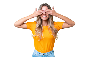 Young Uruguayan woman over isolated background covering eyes by hands and smiling