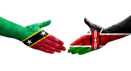 Handshake between Kenya and Saint Kitts and Nevis flags painted on hands, isolated transparent image.