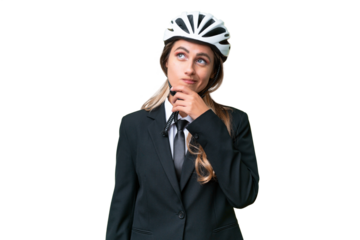 Business Uruguayan woman wearing a helmet biker over isolated background having doubts and with confuse face expression