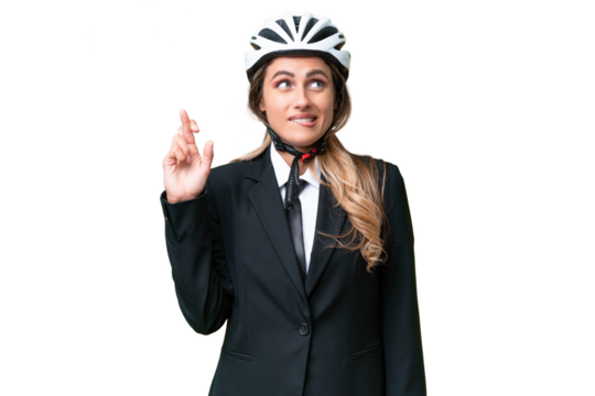 Business Uruguayan woman wearing a helmet biker over isolated background with fingers crossing and wishing the best
