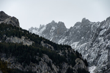 Snow covered peaks of the mountains that surround the area of Val di Mello, in the Masino Valley, Northern Italy 